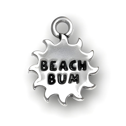 Beach Bum Charm made of sterling silver, featuring a sunburst design with the words 'BEACH BUM' in bold letters.