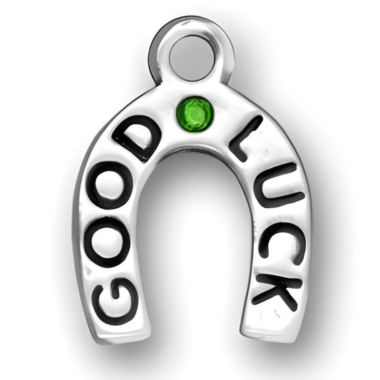 Good Luck charm in sterling silver featuring the words 'GOOD LUCK' and a green crystal accent.