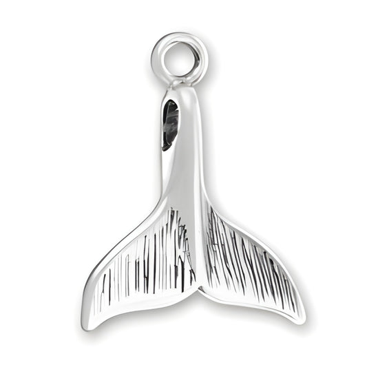 Charm Factory Medium Whale Tail Charm made of polished silver, featuring detailed engravings on the tail fins.