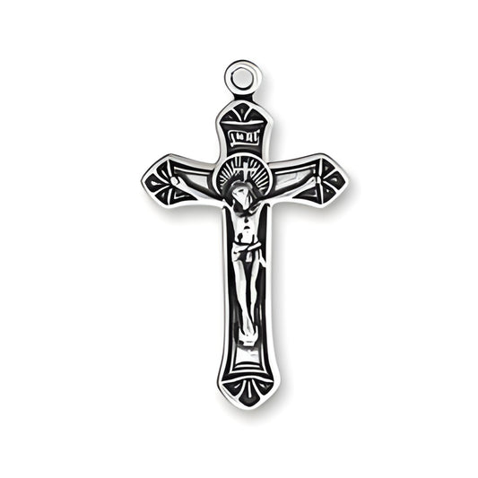 Small ornate crucifix charm made of sterling silver, featuring detailed design with figure of Christ on the cross.