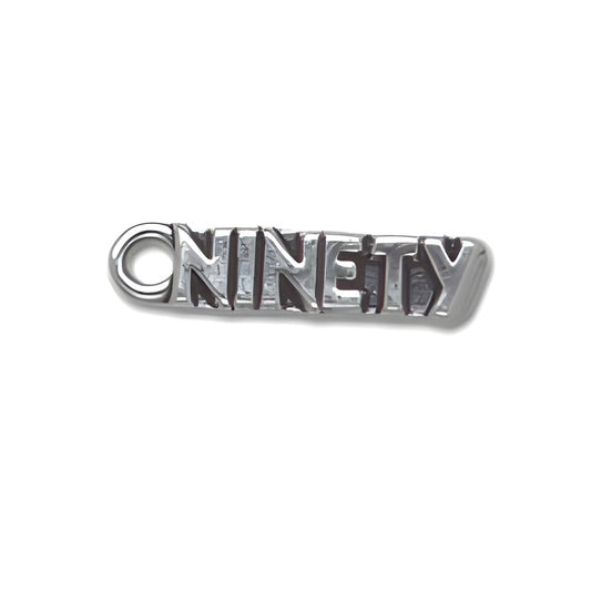 Sterling Silver Ninety Charm featuring the word 'NINETY' in bold letters with a circular loop for attachment.