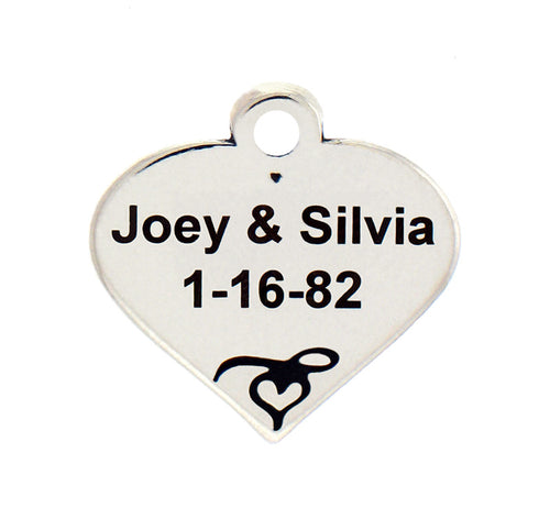 Charm Factory Heart Charm made of silver, engraved with names 'Joey & Silvia' and date '1-16-82'.