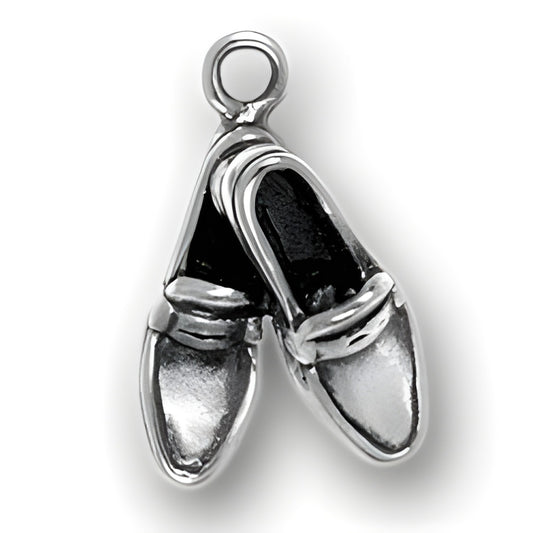 Charm Factory Crossed Loafer Charm made of silver, featuring a detailed design of two crossed loafers.