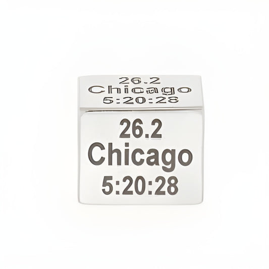 Personalized Rectangle Runner Bead by Charm Factory, made of silver, engraved with '26.2 Chicago 5:20:28'.