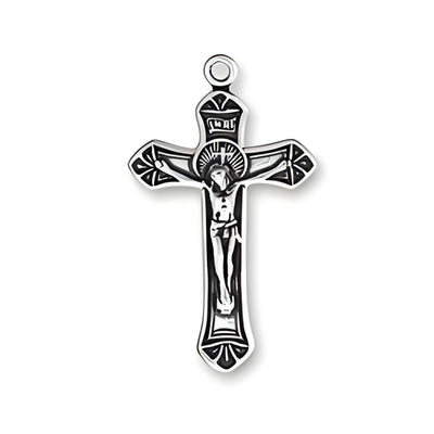 Small ornate crucifix charm made of sterling silver, featuring detailed design with figure of Christ on the cross.