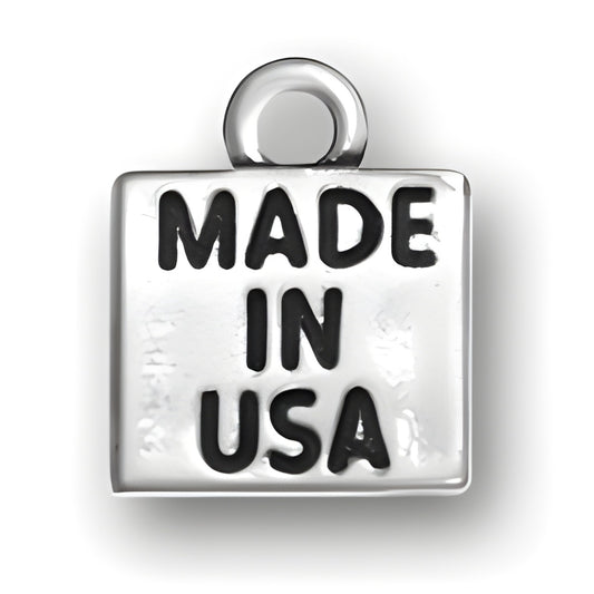 Sterling silver charm with the engraved text 'MADE IN USA' in bold letters.